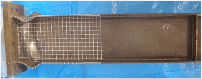 I-section showing wavy lines indicating local buckling in the compression flange and/or web.